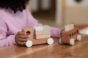 Child playing with wooden toys - Childcare Consultant in Sydney
